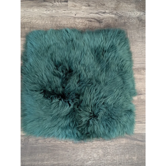 Teal fluffy sheepskin pet square with soft natural texture fits ikea storage units and sheepskin squares perfectly