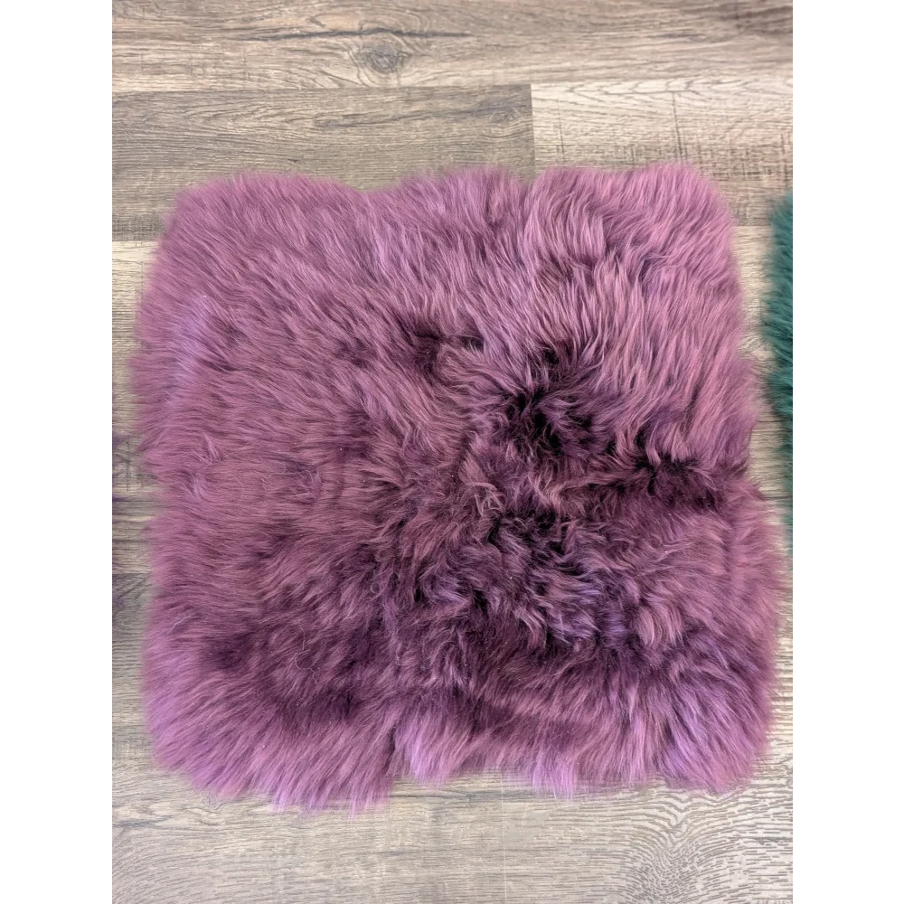 A plush purple sheepskin pet square with soft natural fur pile perfect for ikea storage units and sheepskin squares