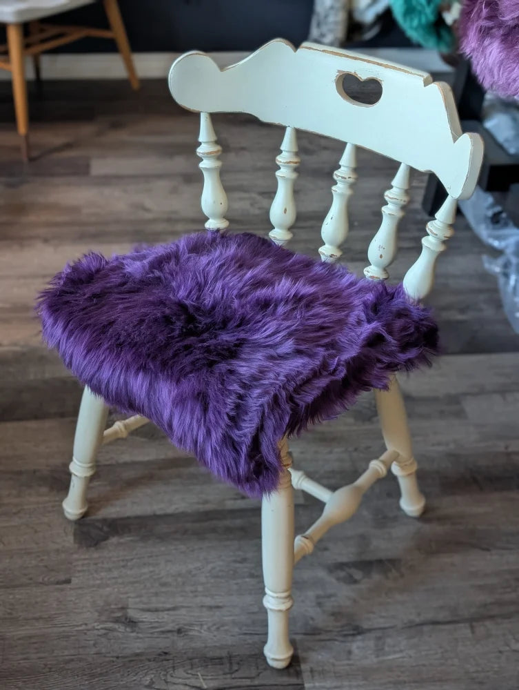 Grape purple merino sheepskin chair pad with heart cutout, meeting strict European standards