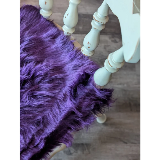 Grape purple sheepskin chair pad with faux fur, mint legs, white pom-poms