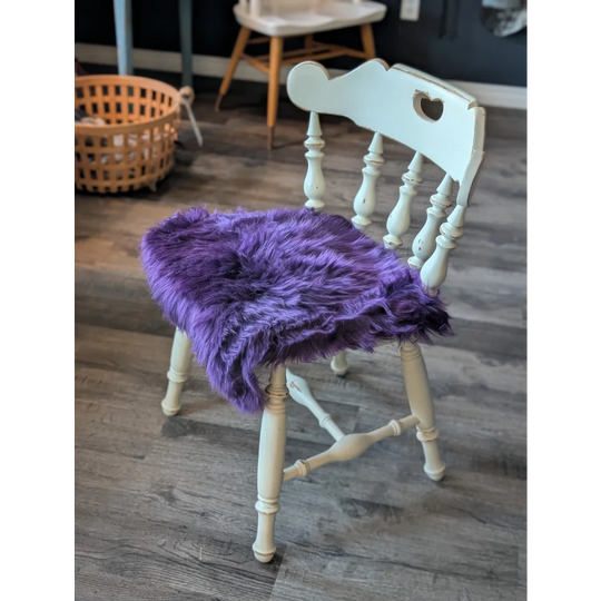 Grape purple merino sheepskin chair pad with heart cutout, meets strict European standards