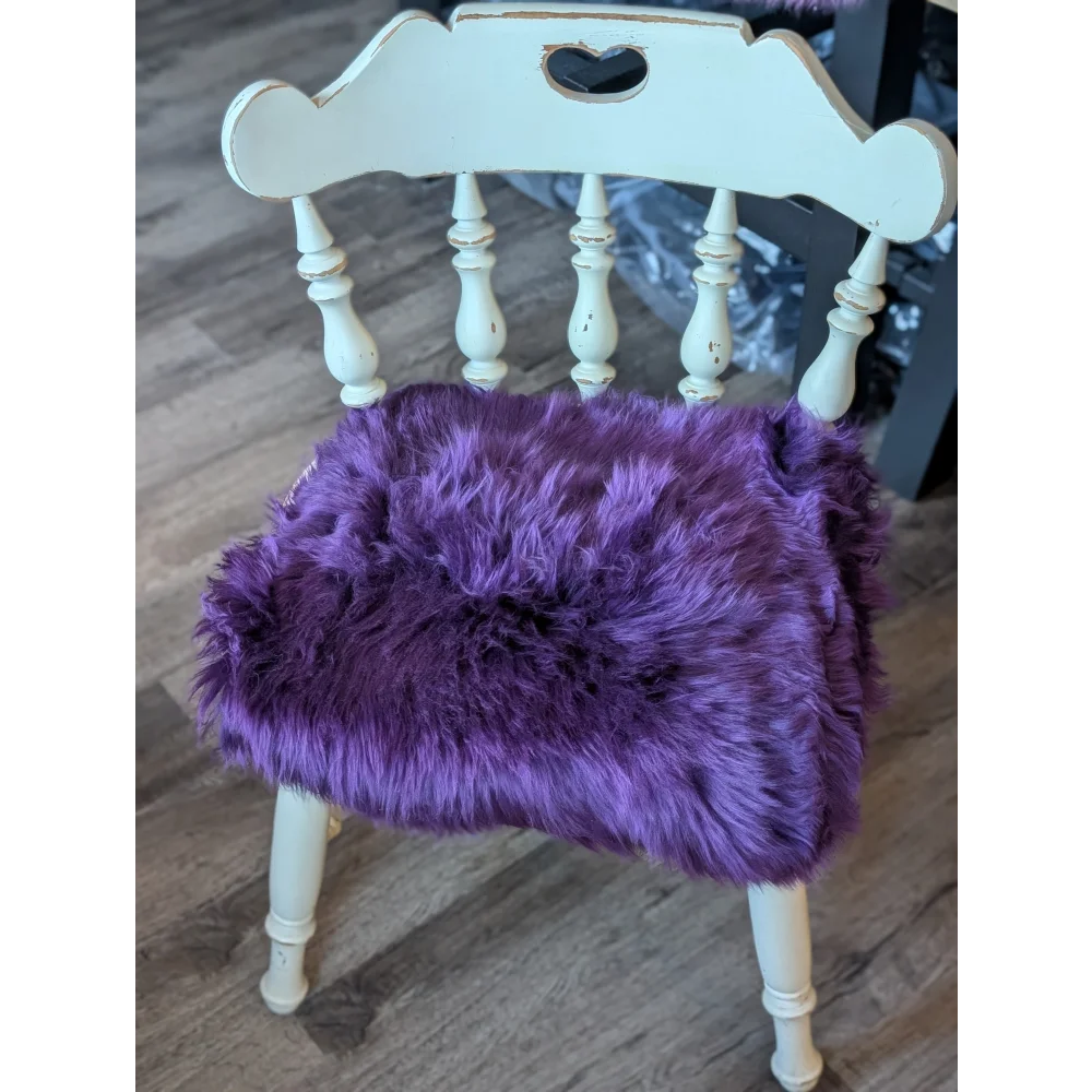 Grape purple merino sheepskin chair pad with lavender faux fur and heart cutouts