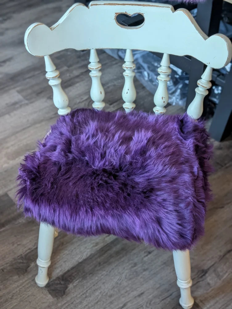Grape purple merino sheepskin chair pad with lavender faux fur and heart cutouts