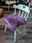 Plum purple merino sheepskin chair pad with heart cutout, eco friendly