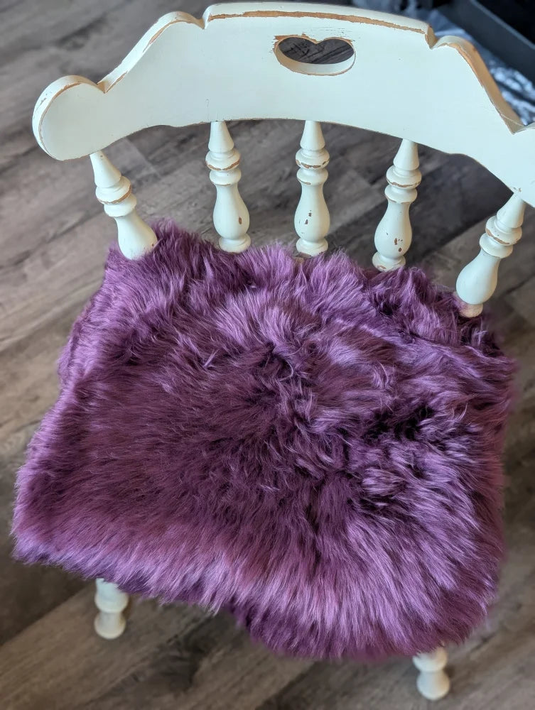 Plum purple lavender faux fur chair pad with heart cutout on white frame