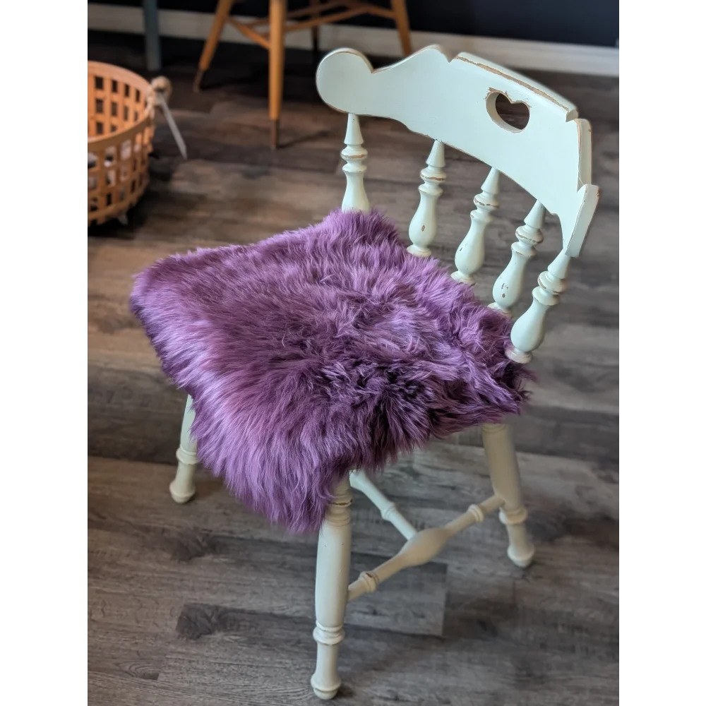 Plum purple merino sheepskin chair pad with lavender faux fur heart cutout