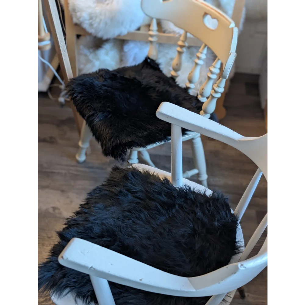 Gorgeous black merino sheepskin chair pad with gold tassels
