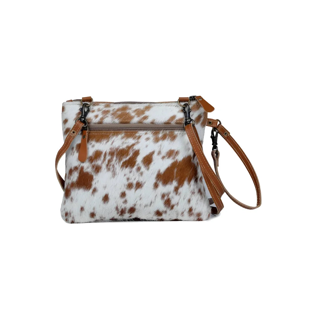 Ornate brown leather hairon bag with cowhide and tan straps