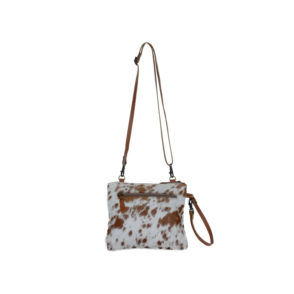 Ornate brown leather hairon bag with cowhide spots and tan straps