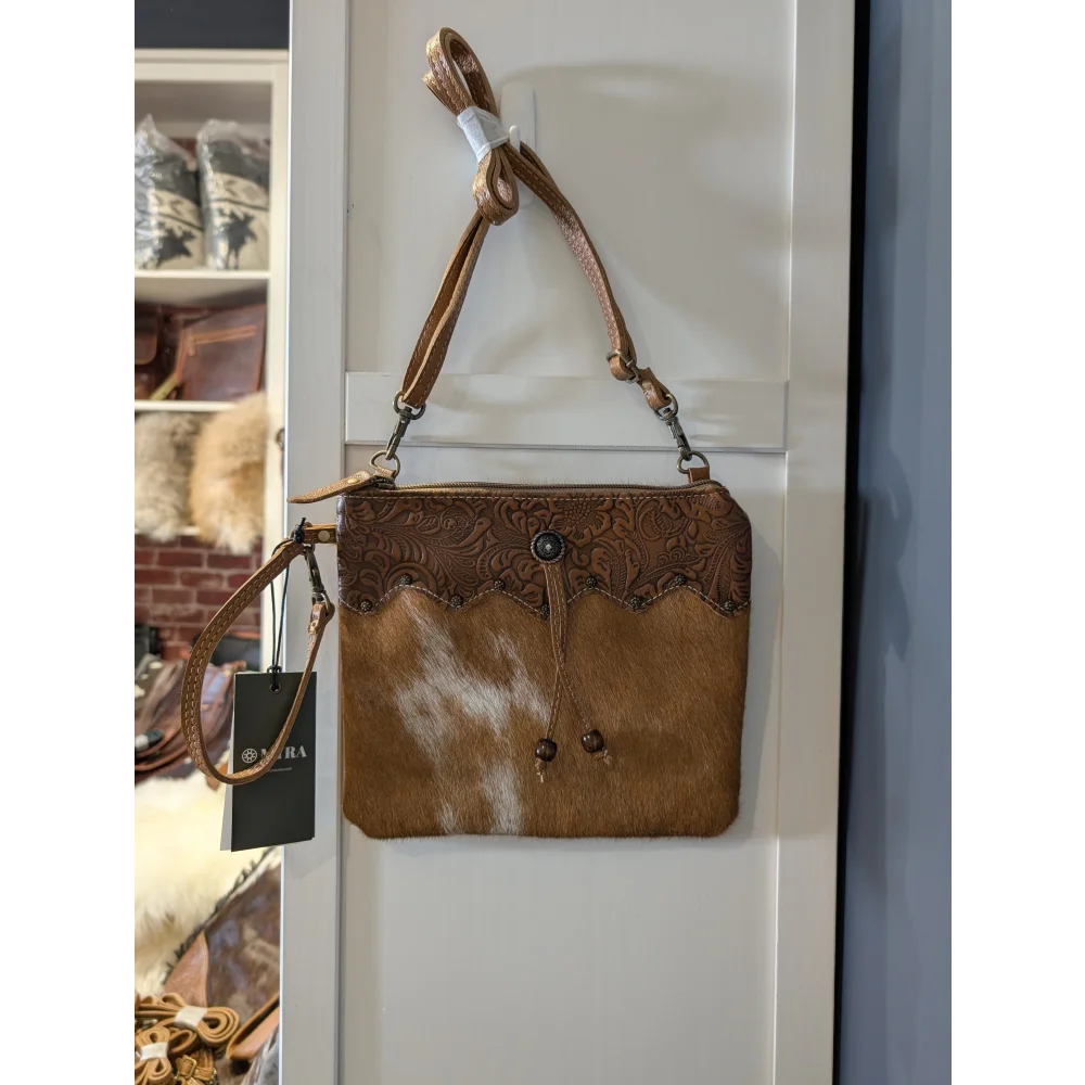 Ornate brown leather hairon bag with embossed floral cowhide flap