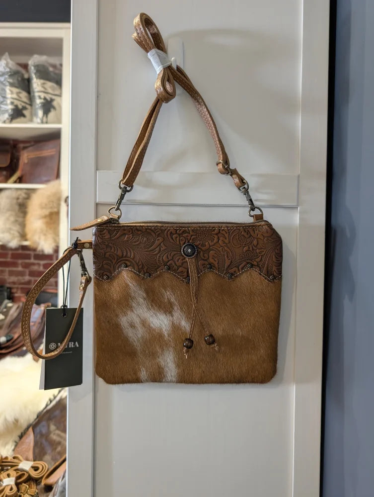Ornate brown leather hairon bag with embossed floral cowhide flap