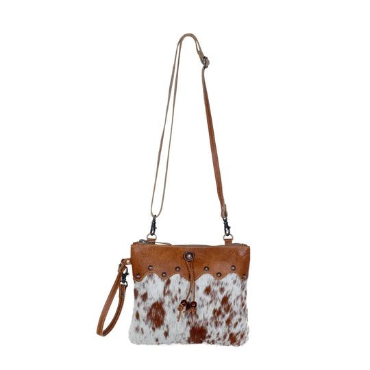 Ornate brown leather hairon bag with cowhide, studs, tan trim