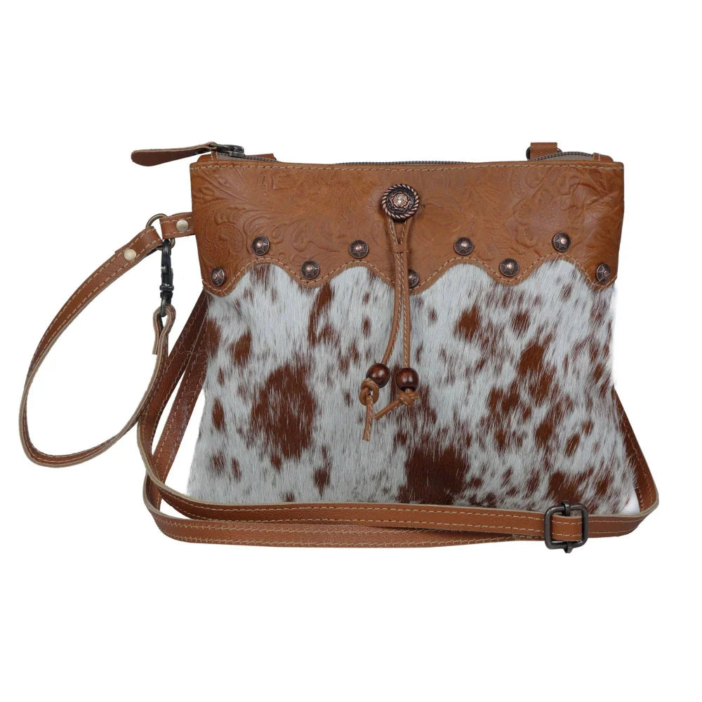 Ornate brown leather hairon bag with cowhide, studs, tan trim
