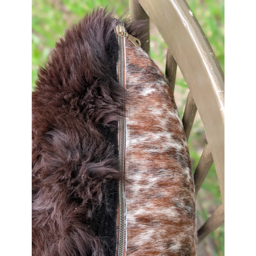 Brown and white brazilian cowhide cushions with dark brown faux fur trim handmade for cozy home decor