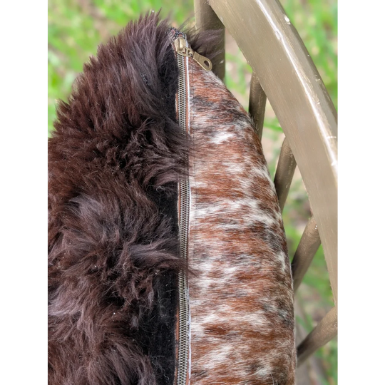 Brown and white brazilian cowhide cushions with dark brown faux fur trim handmade for cozy home decor