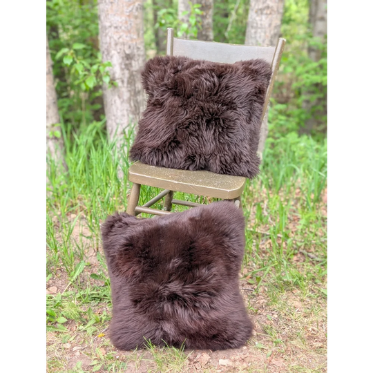 Pair of handmade dark brown plush brazilian cowhide cushions perfect as cozy british sheepskin throw pillows
