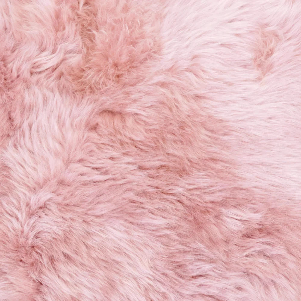 Soft pink dyed merino sheepskin rug with plush fluffy texture made under strict european standards arriving mid october