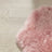 A soft fluffy pink merino sheepskin rug with natural curly texture made from strict european dyed merino sheepskins