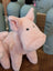A large size pink piggies soft plush toy with black button eyes and textured fabric body