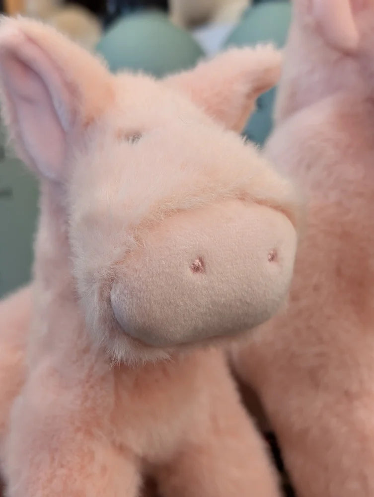 A large size soft pink piggy plush with fluffy texture and embroidered eyes from pink piggies collection