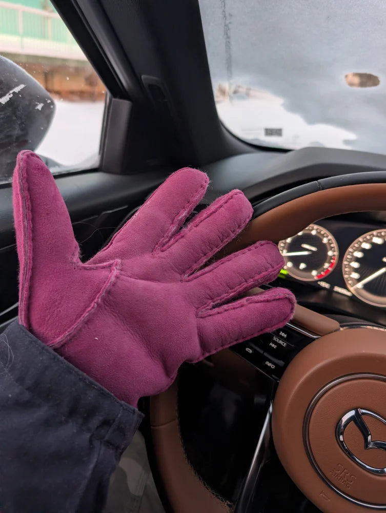 Plush pink sheepskins gloves in magenta suede with visible stitching