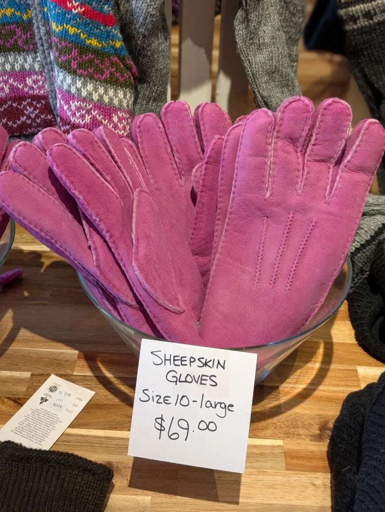 Two pairs of pink sheepskin gloves in brilliant shade, size 10-12