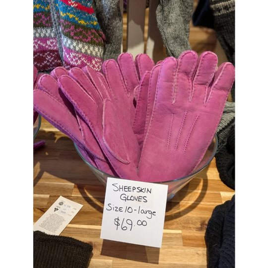 Two pairs of pink sheepskin gloves in brilliant shade, size 10-12