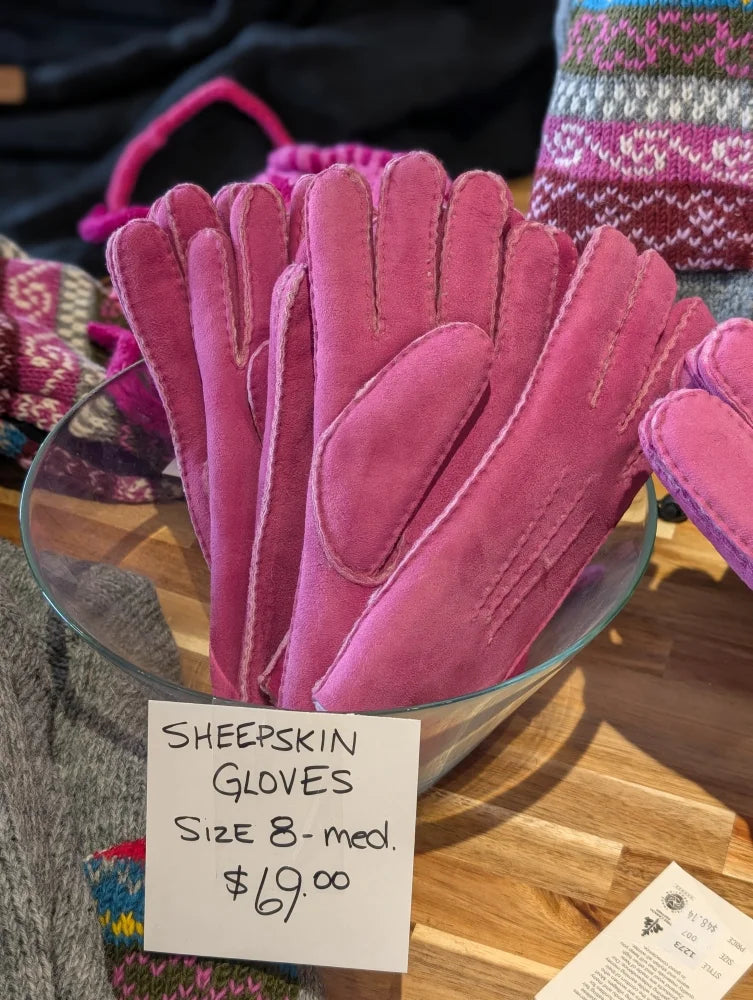 Two pairs of pink sheepskin gloves in brilliant shade, size 8, $69