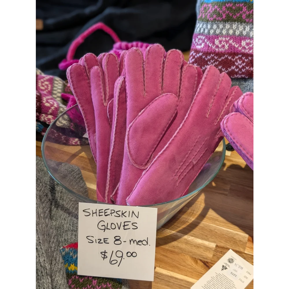 Two pairs of pink sheepskin gloves in brilliant shade, size 8, $69