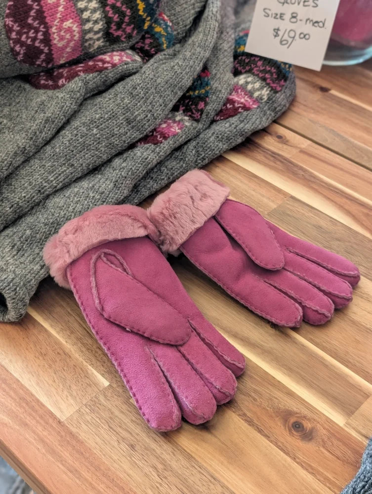 Two pairs of brilliant shade pink sheepskin gloves with fur trim