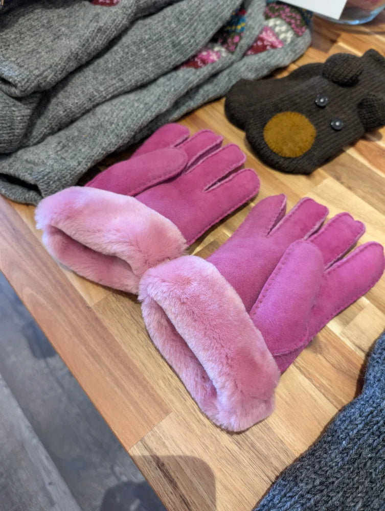 Two pairs of pink sheepskin gloves in brilliant shade with fur lining
