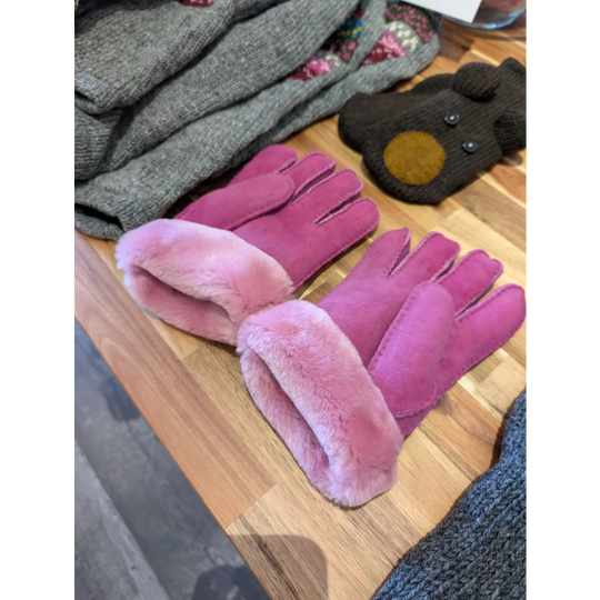 Two pairs of pink sheepskin gloves in brilliant shade with fur lining
