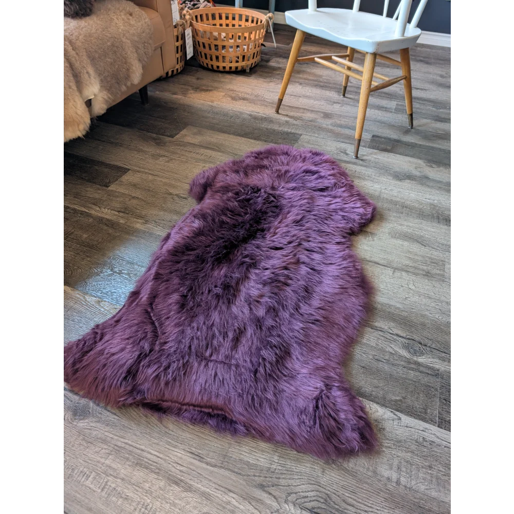 Gorgeous plum purple merino sheepskin throw with plush faux fur texture