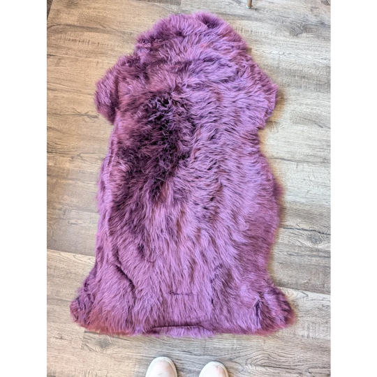 Gorgeous plum purple merino sheepskin throw with plush faux fur texture