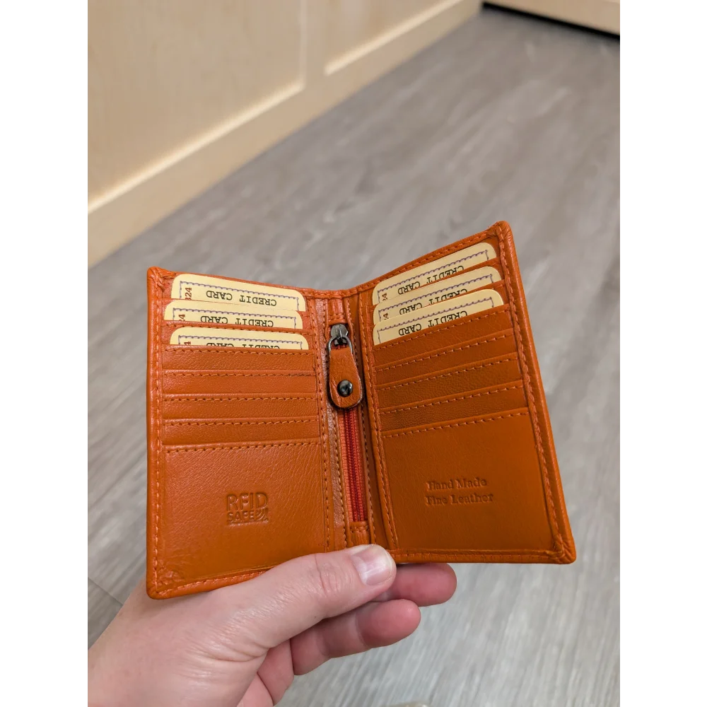 Orange leather pocket card holder with card slots and zipper