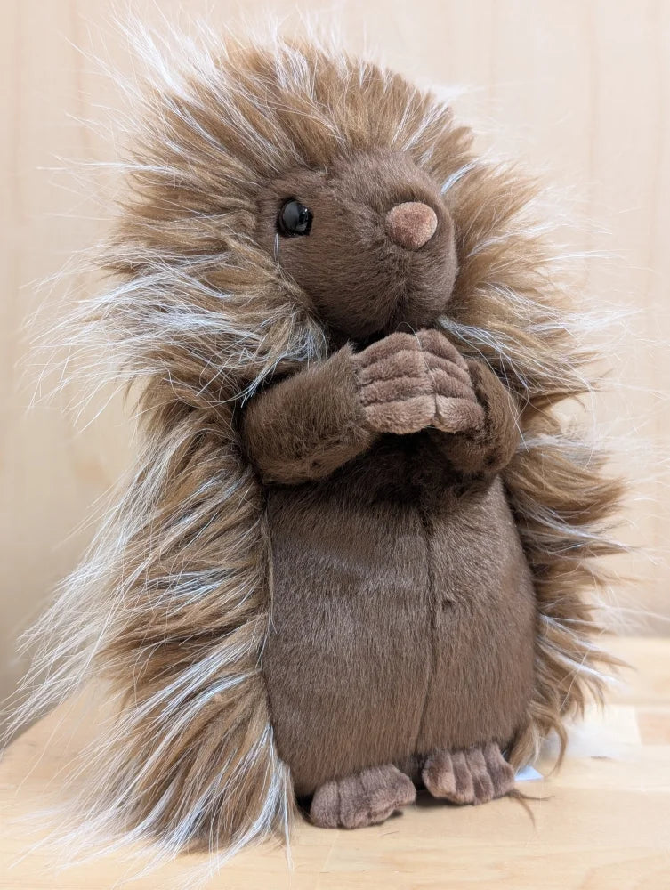 A plush brown prickle porcupine with long spiky fur and a soft cuddly texture perfect for hugging
