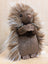 A plush brown prickle porcupine with long spiky fur and a soft cuddly texture perfect for hugging