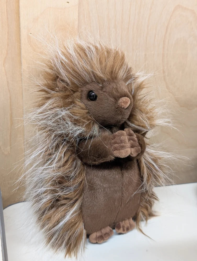A plush brown prickle porcupine with long spiky fur and soft cuddly texture perfect for hugging