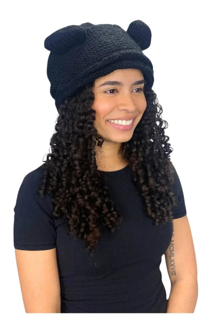 Black knitted rana hat with bear ear accents made from zealand wool and cozy fleece lining for warmth
