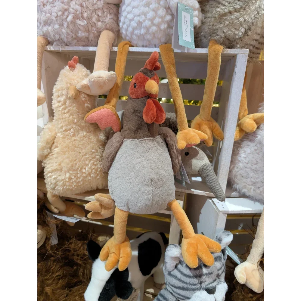 Angus Oliver gray plush chicken toy with sheepskin rug vibes