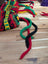 Multicolored woven wool hats bag with bell accents and patterns