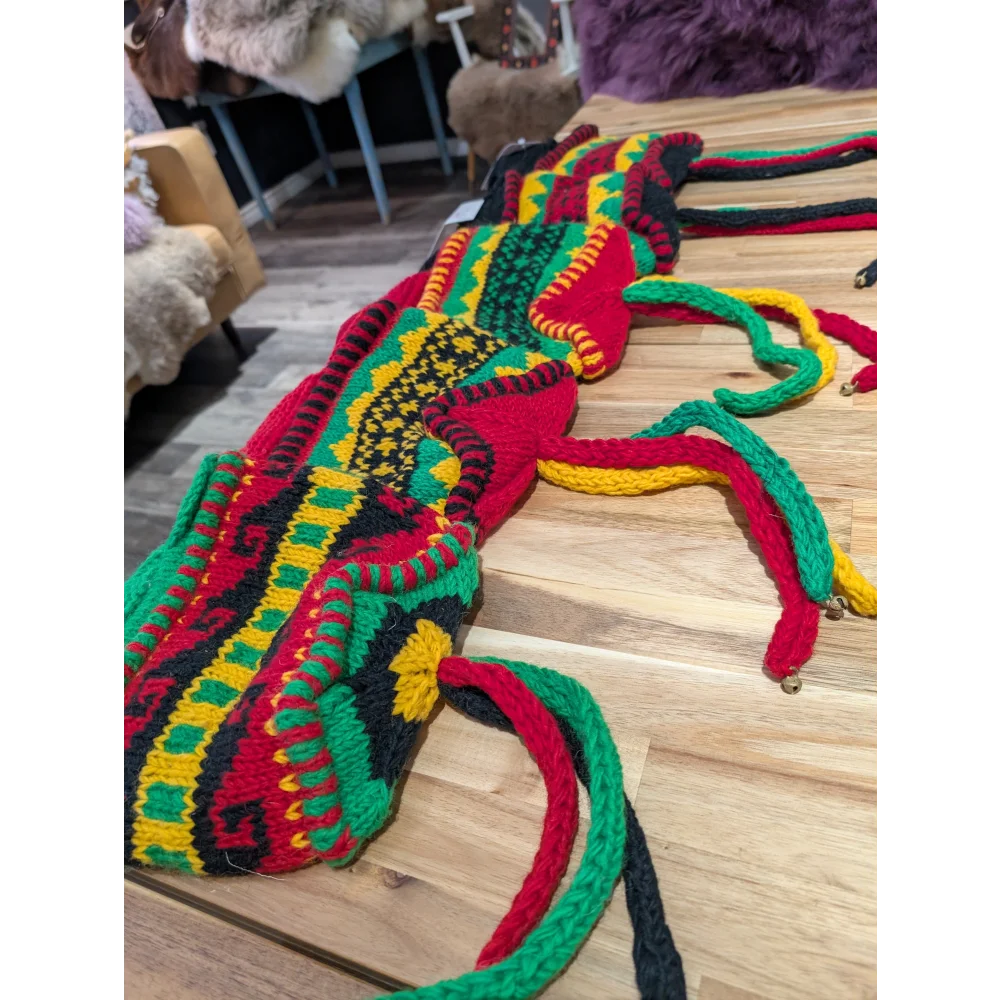 Vibrant multicolored crocheted wool hats bag with intricate patterns