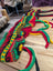 Vibrant multicolored crocheted wool hats bag with intricate patterns
