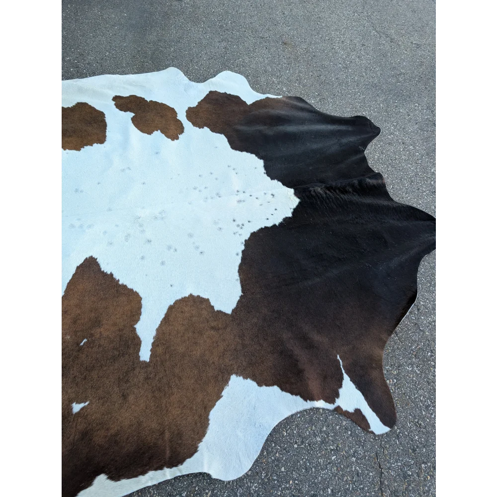 Extra large cowhide rug with brown and white patches, 96’’ x 84.5
