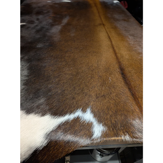 Extra large cowhide rug with brown white markings and leather texture