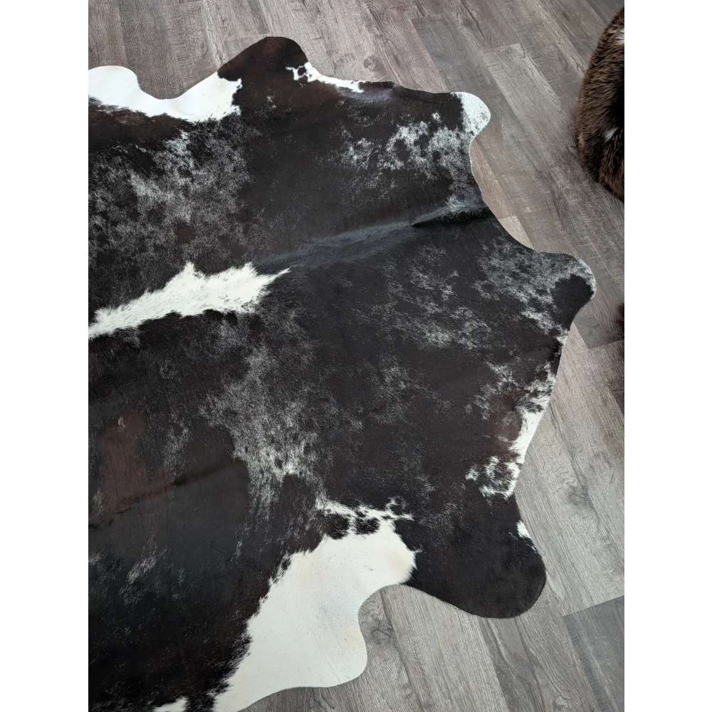 Black and white large cowhide rug with natural irregular edges extra large reddish 476 89 by 77 inches