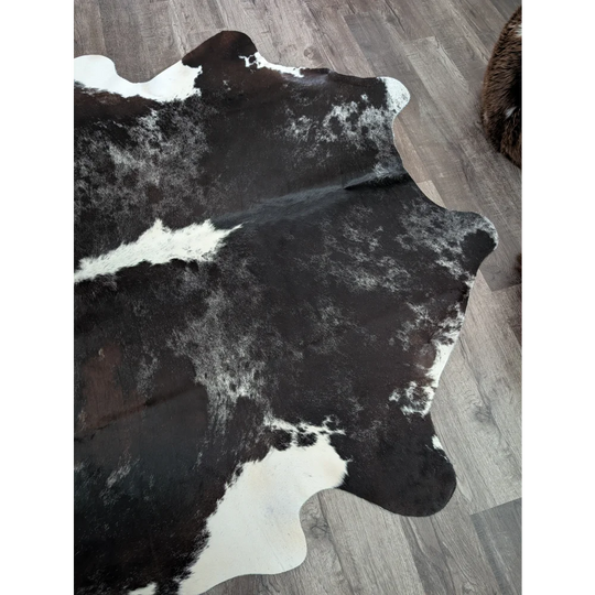 Black and white large cowhide rug with natural irregular edges extra large reddish 476 89 by 77 inches