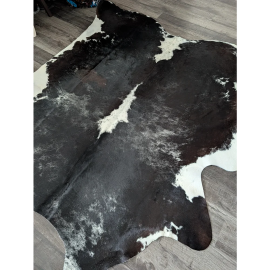 Extra large reddish black and white cowhide rug with natural fur texture large cowhide for stylish decor
