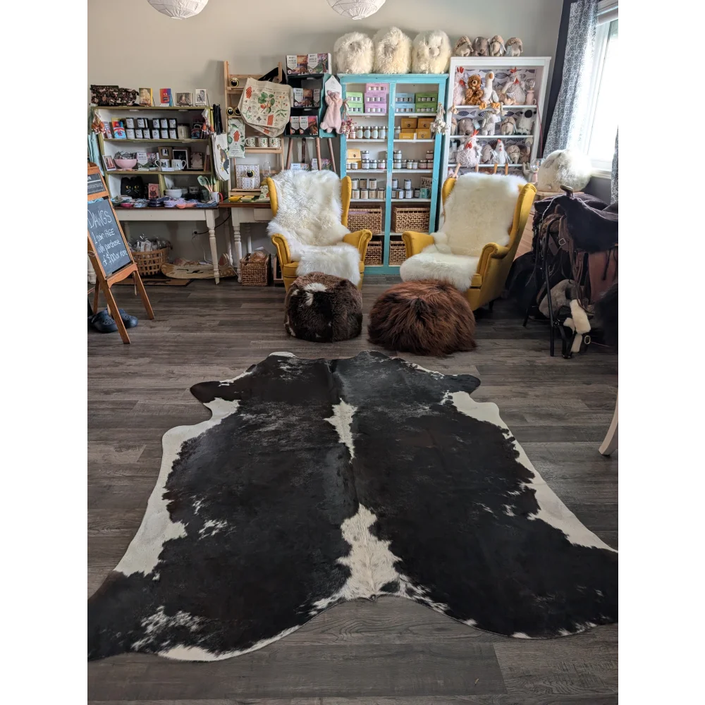 Reddish 476 extra large black and white cowhide rug with natural irregular patterns measuring 89 by 77 inches