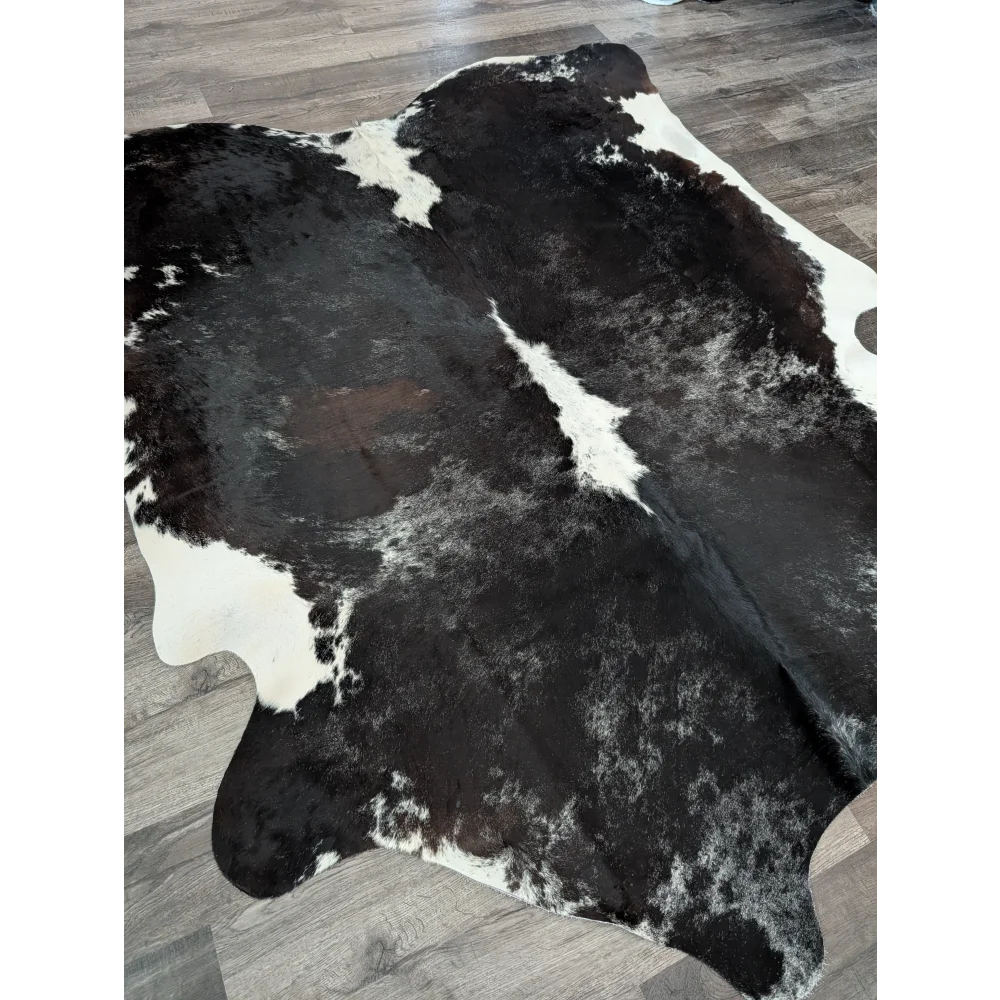 Extra large black and white cowhide rug reddish 476 with natural irregular patterns 89 by 77 inches large cowhide